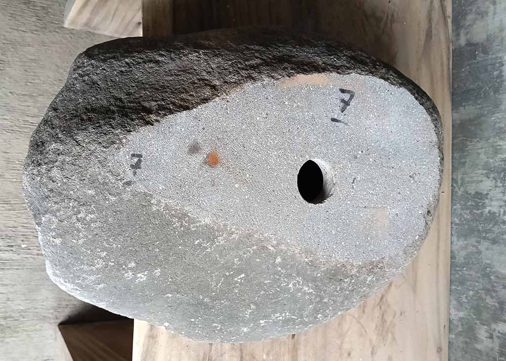 Bottom view of handcrafted river stone sink SKU 6007-5338 revealing natural unfinished stone base