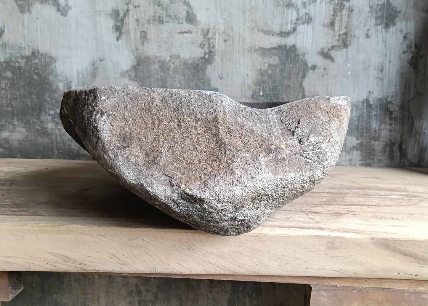 Right side view of oval river stone sink SKU 6007-5338 showing polished interior and raw stone exterior