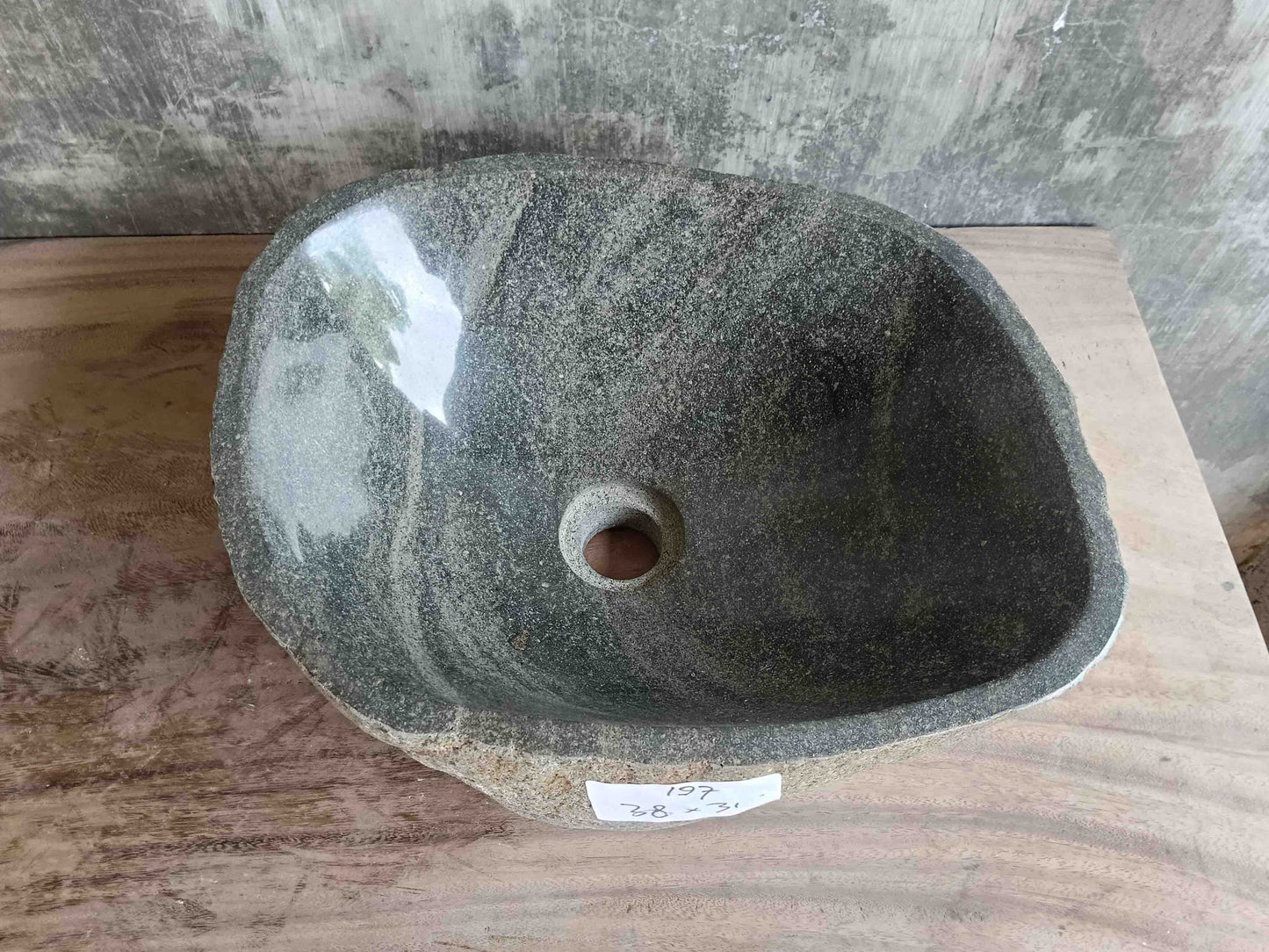 Top view of handcrafted grey 15×12 inch river stone sink with natural streaks in irregular form