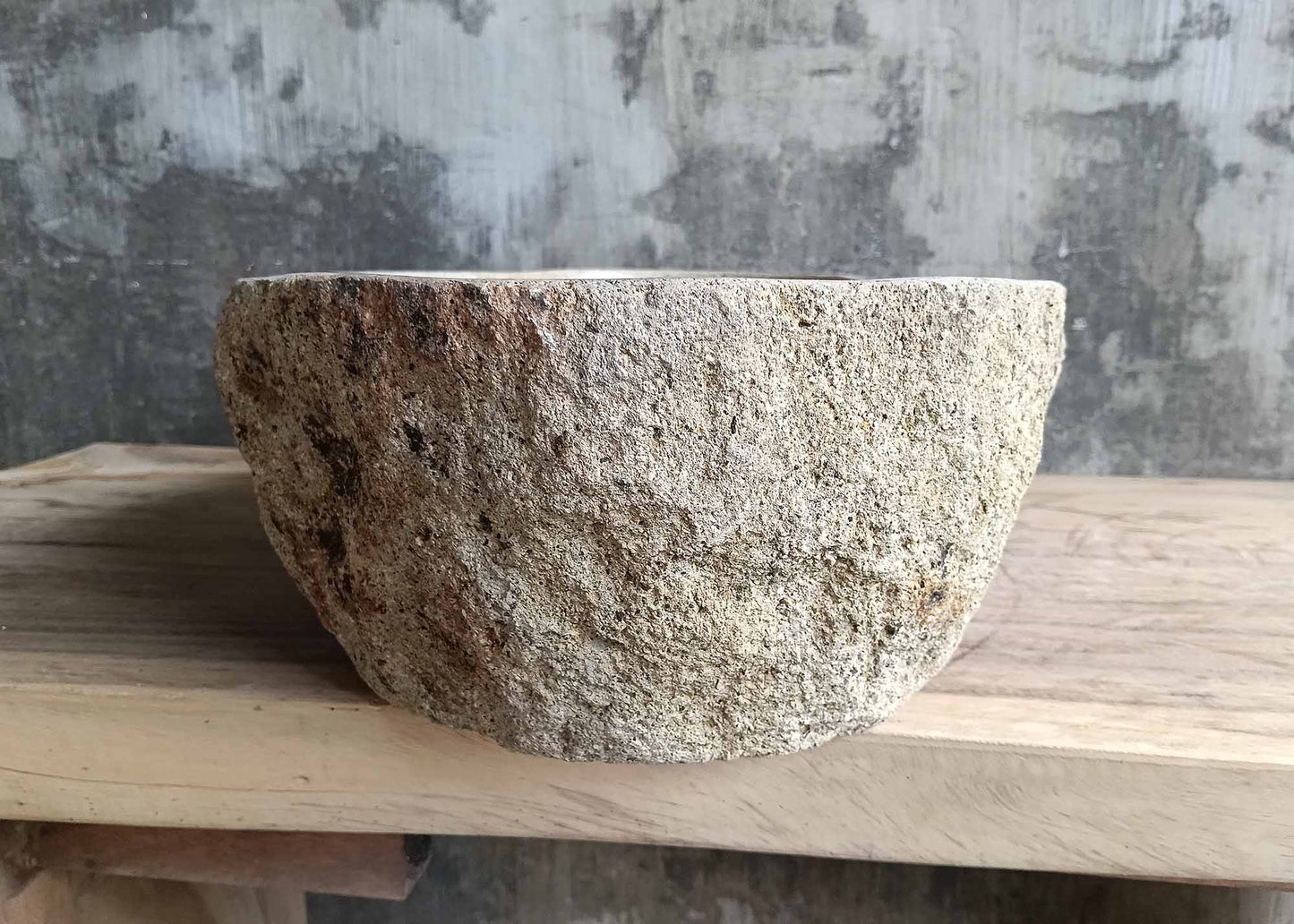 Left side view of rustic river stone sink SKU 6026-5435 with uneven natural stone exterior and polished interior basin