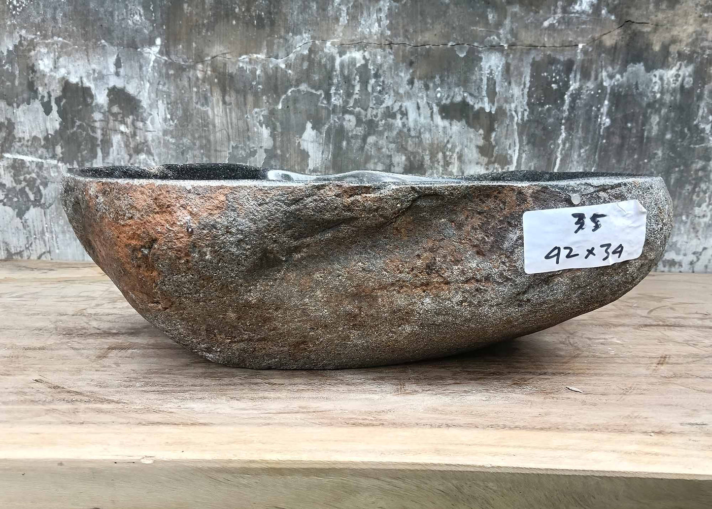 Front view of handcrafted stone sink 6035-4234 showing glossy surface and natural edges