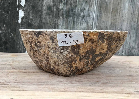 Front view of handcrafted stone sink 6036-4237 showing textured edge and organic shape