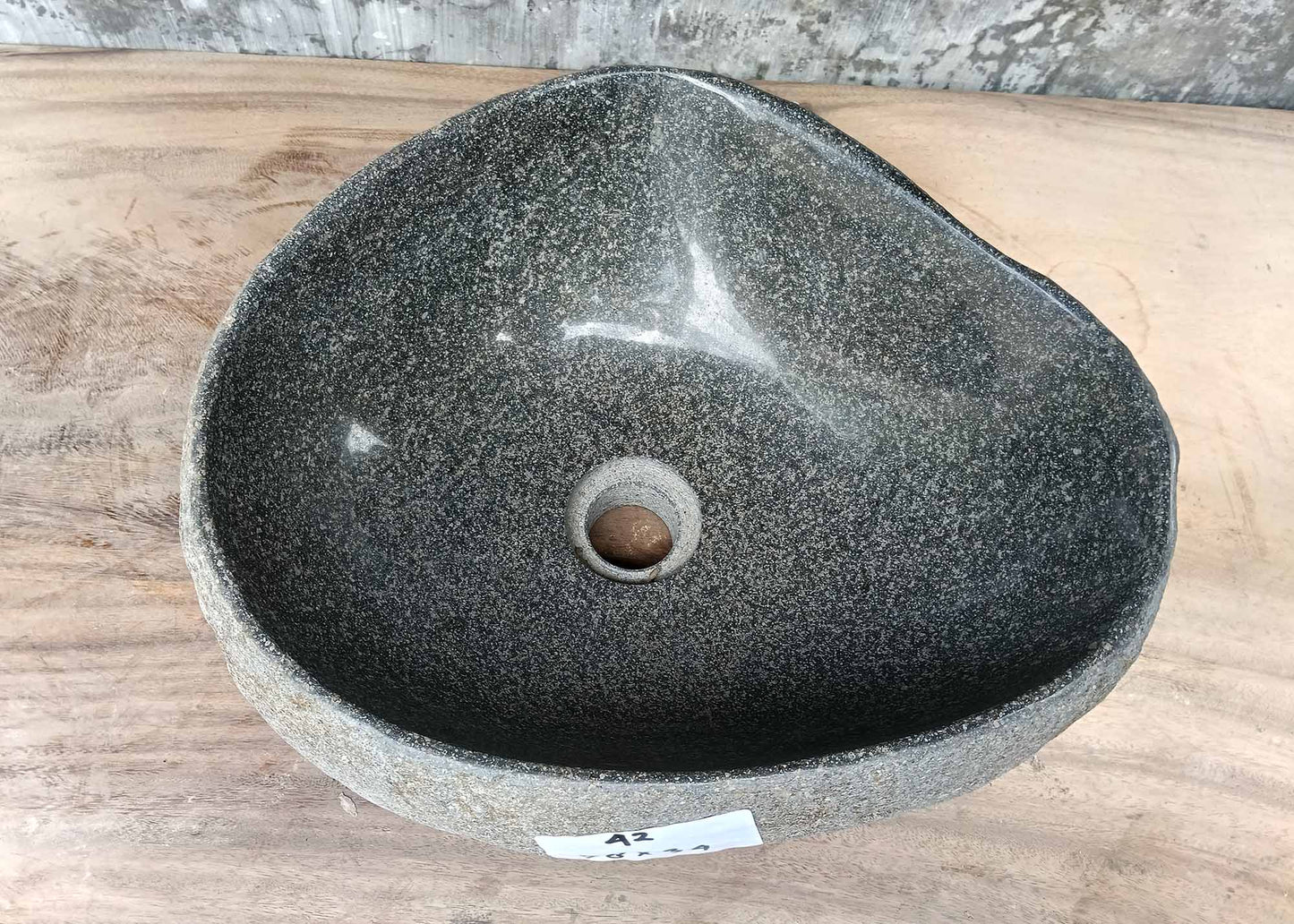 Top view of triangular river stone sink 6042-3834 with light gray polished interior
