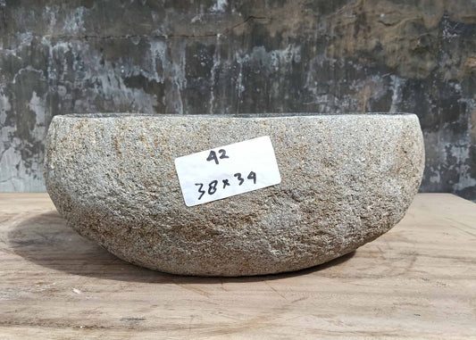 Front view of 6042-3834 river stone sink showing rough sandy gray exterior texture