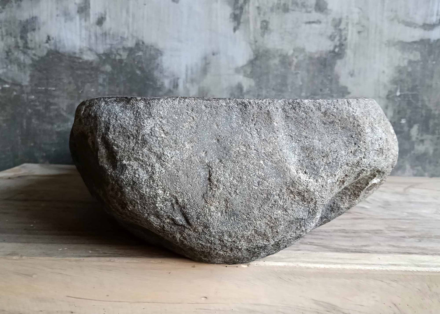 Right side view of oval brown river stone sink SKU 6046-5534 showing polished interior and rugged exterior surface