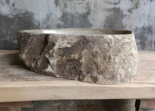 Front view showing rustic brown river stone sink SKU 6050-5338 with natural rugged surface and oval shape