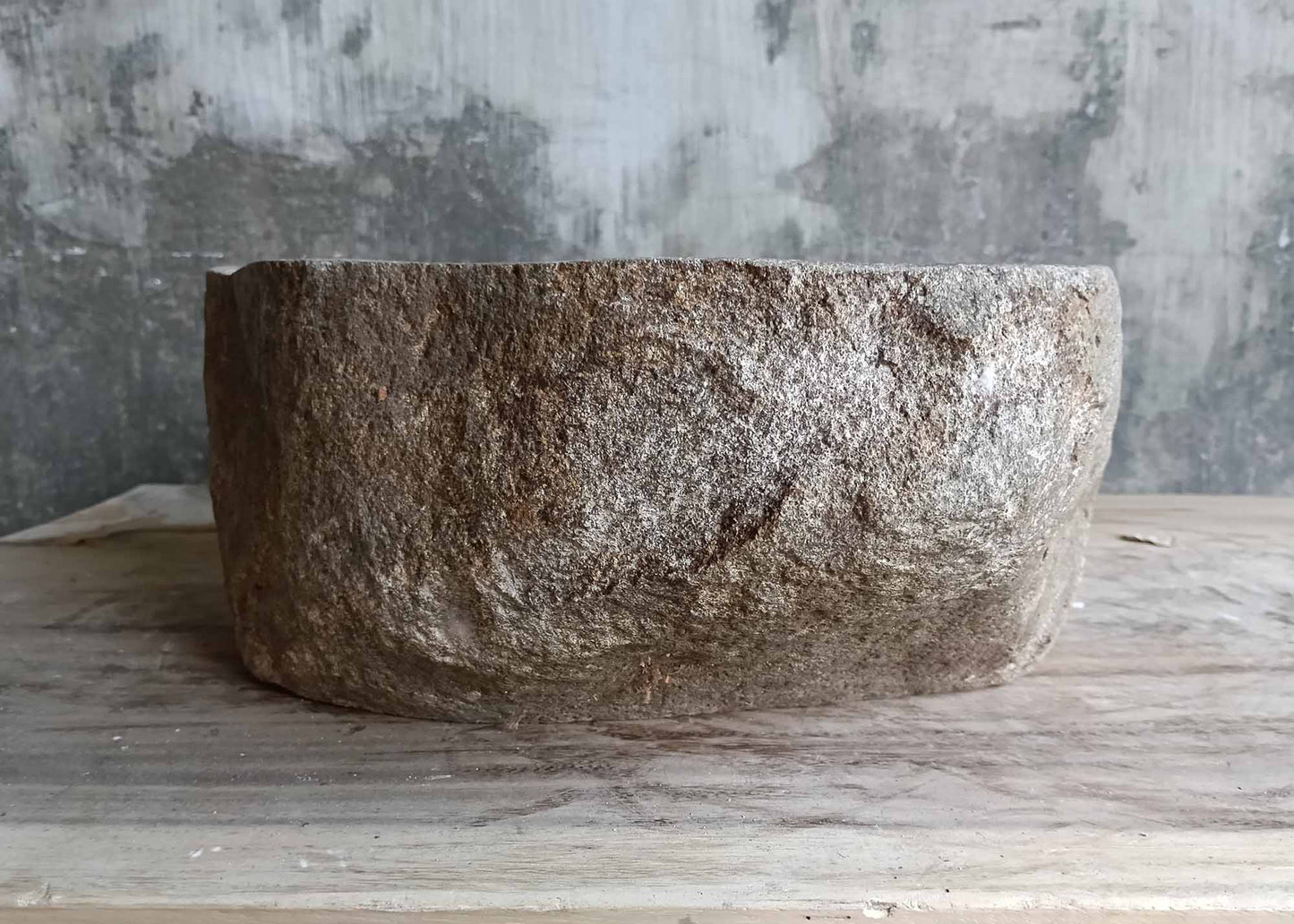 Backside showing raw textured surface of handcrafted stone sink