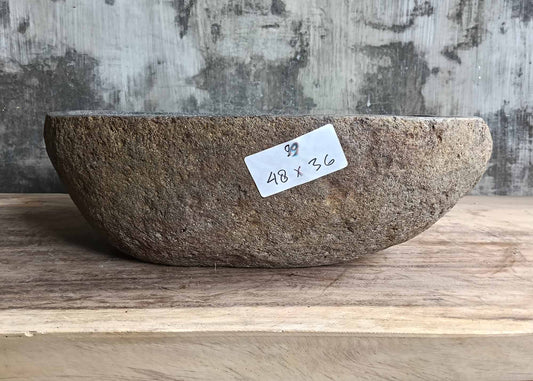 Front angle of handcrafted stone sink 6099-4836 showing natural contours