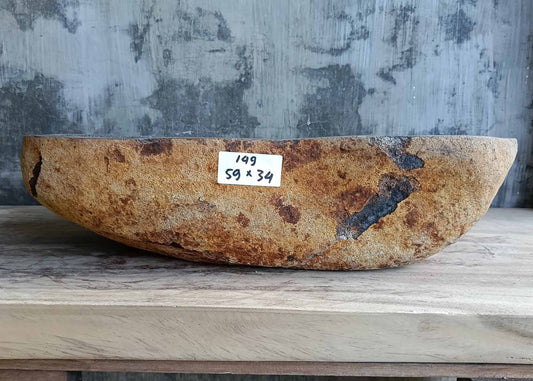 Top view of river stone sink SKU 6149-5934 with polished dark interior and natural uneven edges