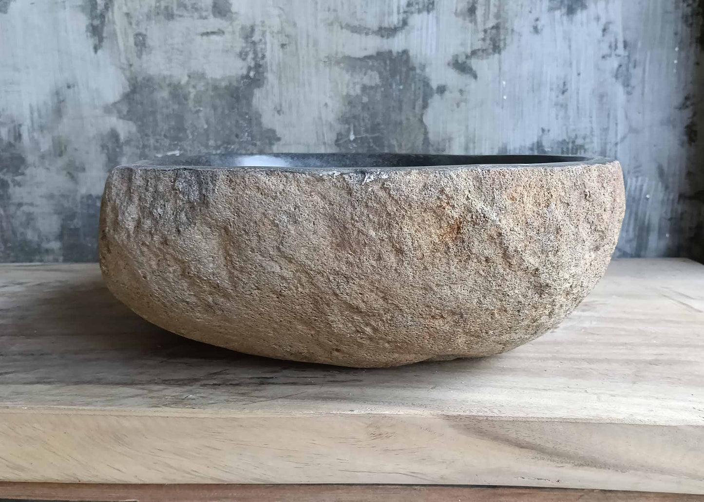 Left side of river stone sink SKU 6151-5038 with rough natural surface and smooth inner finish