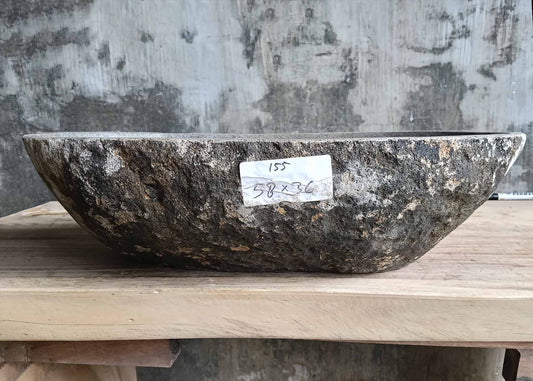 Front view of handcrafted river stone sink SKU 6155-5836 showing rough gray-black granite exterior