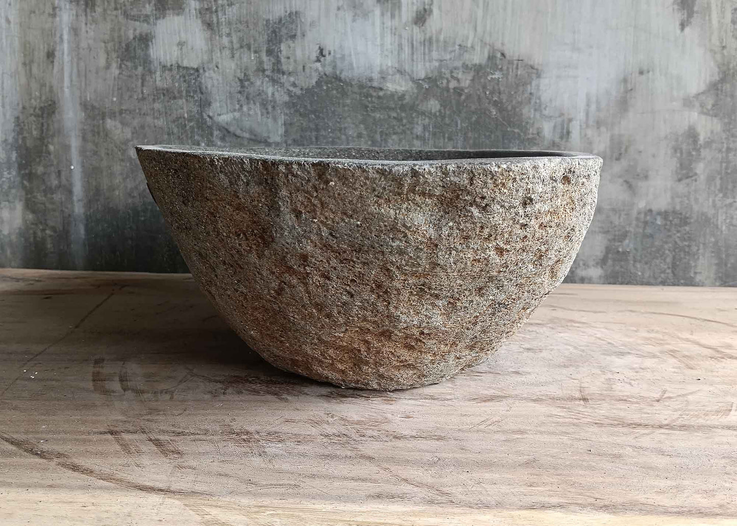 Right side view of 17×12 inch river stone sink in gray with natural stone detail