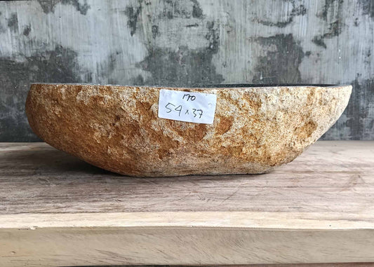 Front view of river stone sink SKU 6170-5437 showing golden-beige rugged stone exterior and deep bowl