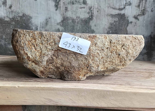 Front angle of handcrafted river stone sink with raw textured outer shell – 6173-4332