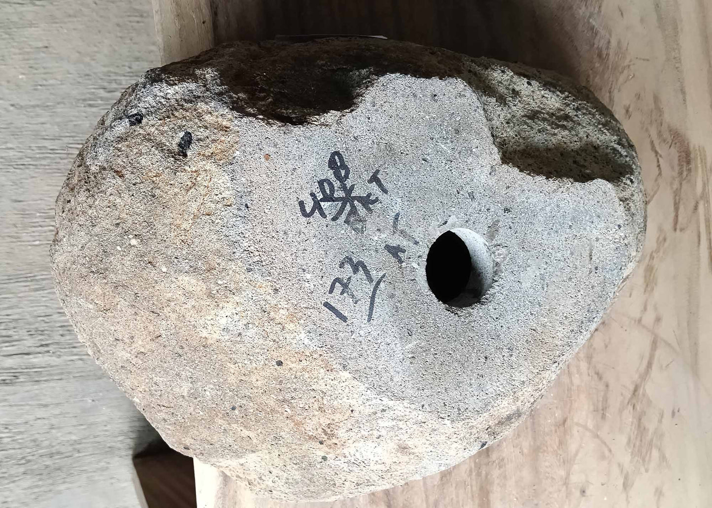 Underside of handcrafted river stone sink with natural unpolished base – 6173-4332