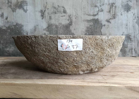 Front angle of handcrafted dark gray stone sink with rough outer surface – 6174-4637