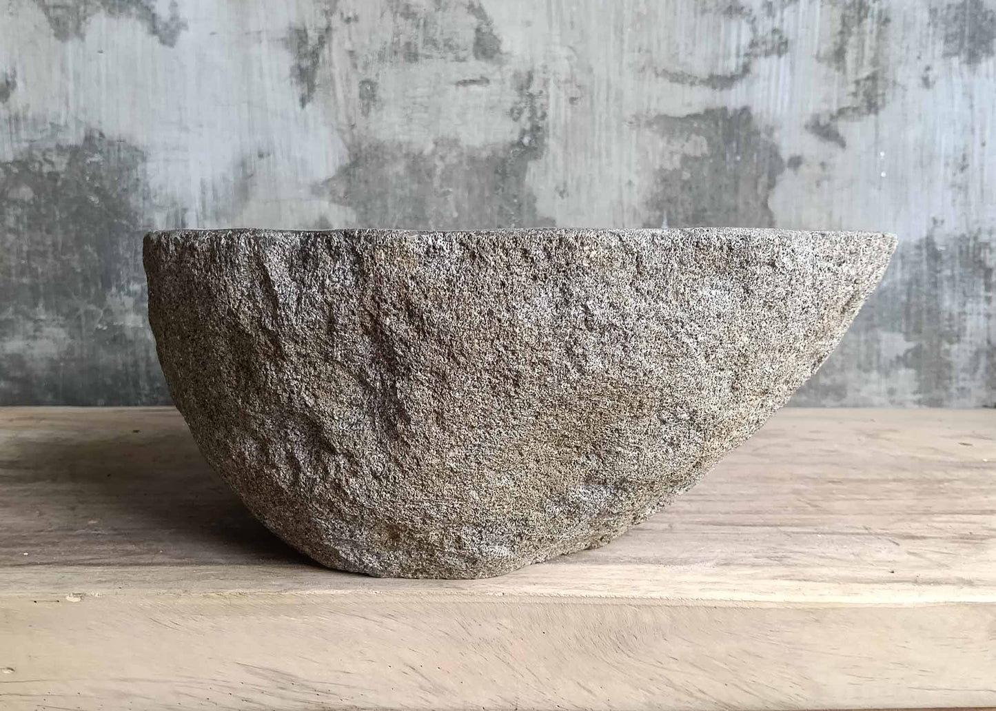 Left profile of dark oval stone sink with clean interior and organic shape – SKU 6174-4637