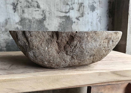 Front view of handcrafted sink SKU 6180-5035 showing rugged brown exterior and asymmetric natural curve