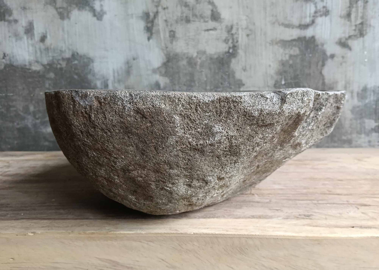 Left side of river stone sink SKU 6180-5035 highlighting raw stone texture and gentle basin slope