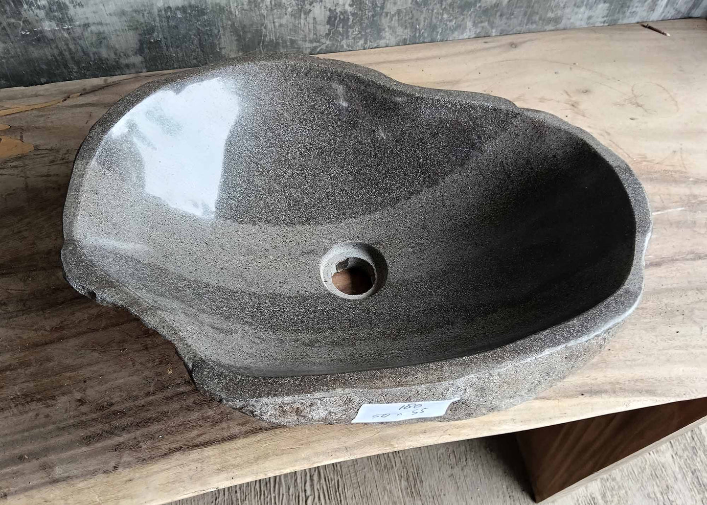Top view of river stone sink SKU 6180-5035 with soft gray polished interior and organic flowing shape