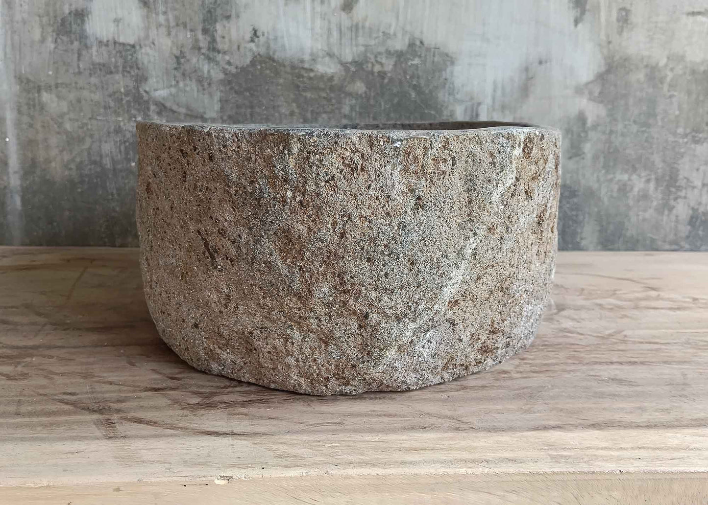 Back view of 16×12 inch oval gray river stone sink with natural texture and clean lines