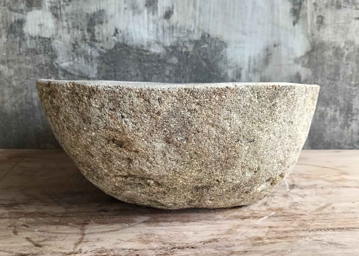 Right side view of light 17×14 inch stone sink showing polished interior and raw surface