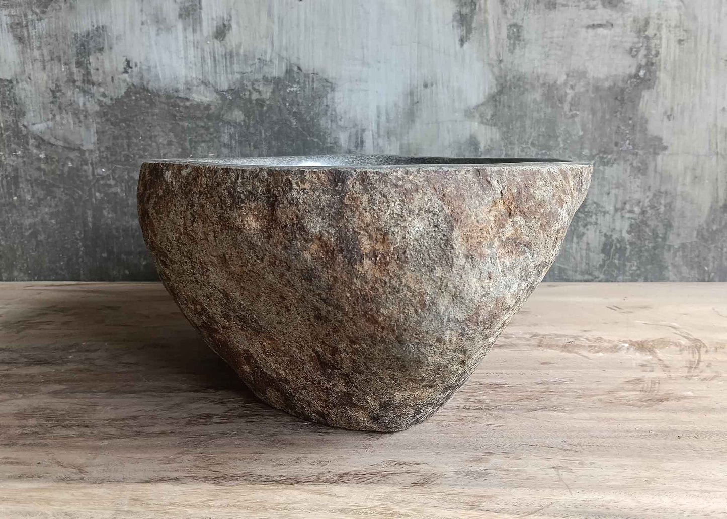 Right side view of gray oval 16×13 inch river stone sink with handcrafted finish