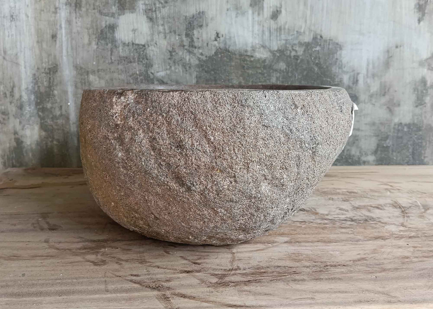 Left side view of brown 16×13 inch river stone sink with glossy interior and boat profile