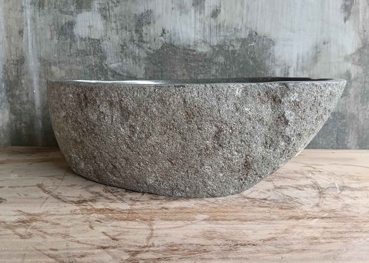 Front side of 18×13 inch gray stone sink showing organic shape and raw exterior texture