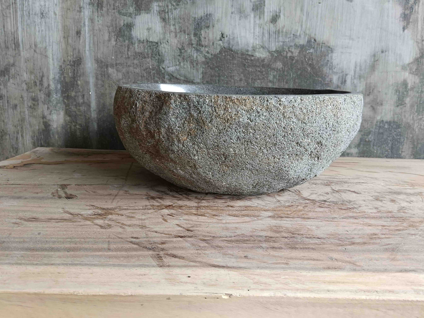 Left side view of 15×13 inch grey river stone sink showing boat-like profile