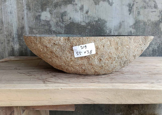 Natural stone sink 6219-5538 with raw tan exterior and sculpted triangular form