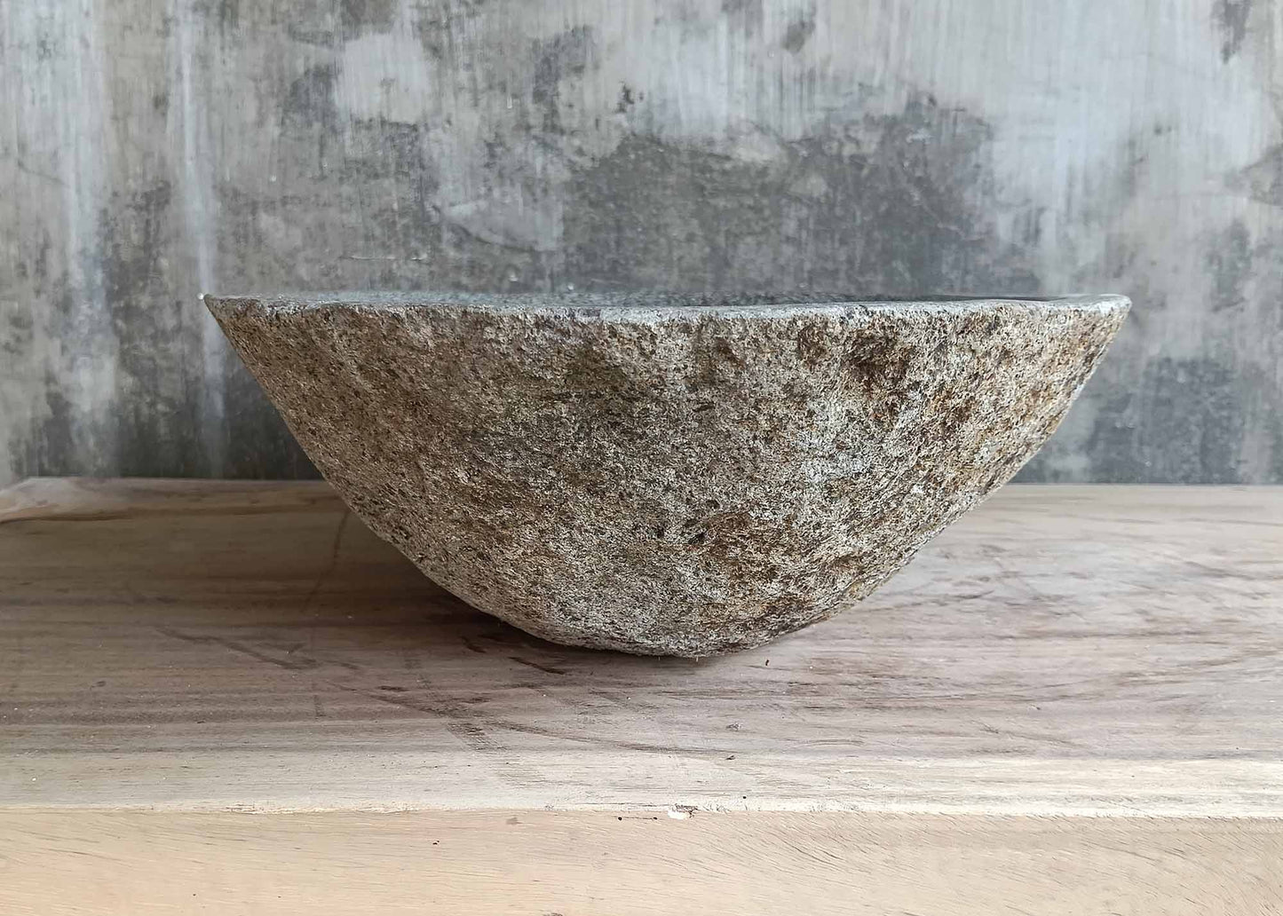 Left side of river stone sink 6221-5036 with rugged stone shell and polished inside
