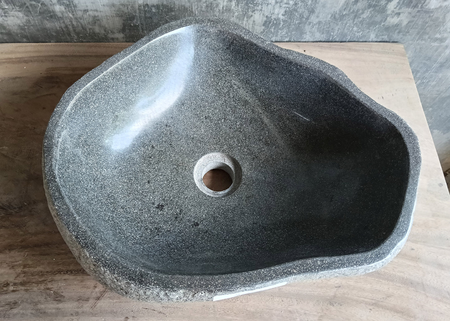 Top view of handcrafted 17x14 inch gray river stone sink with irregular shape