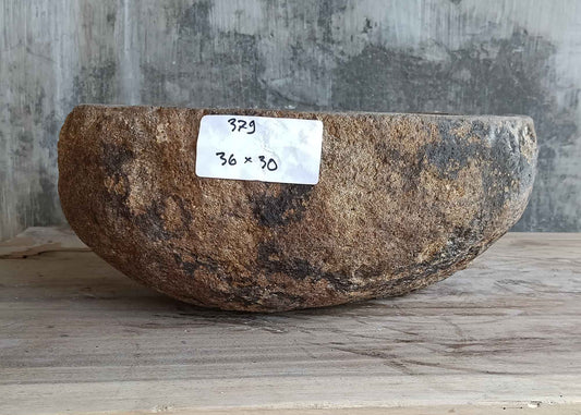 Front side view of light beige 14×12 inch river stone sink showing natural exterior texture