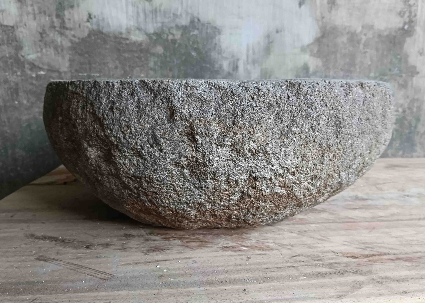 Left side view of 15×13 inch grey river stone sink showing boat-like profile