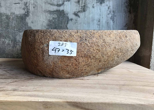 Front view of gray stone sink with geometric natural contours