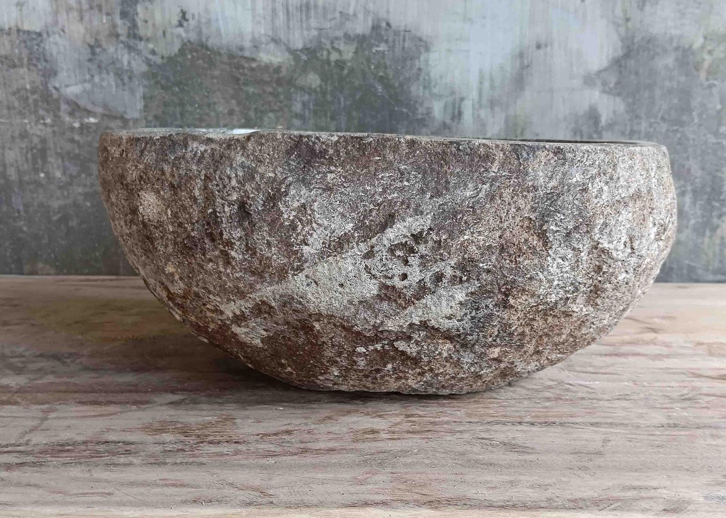 Left side view of 13×12 inch light-gray river stone sink showing boat-like profile