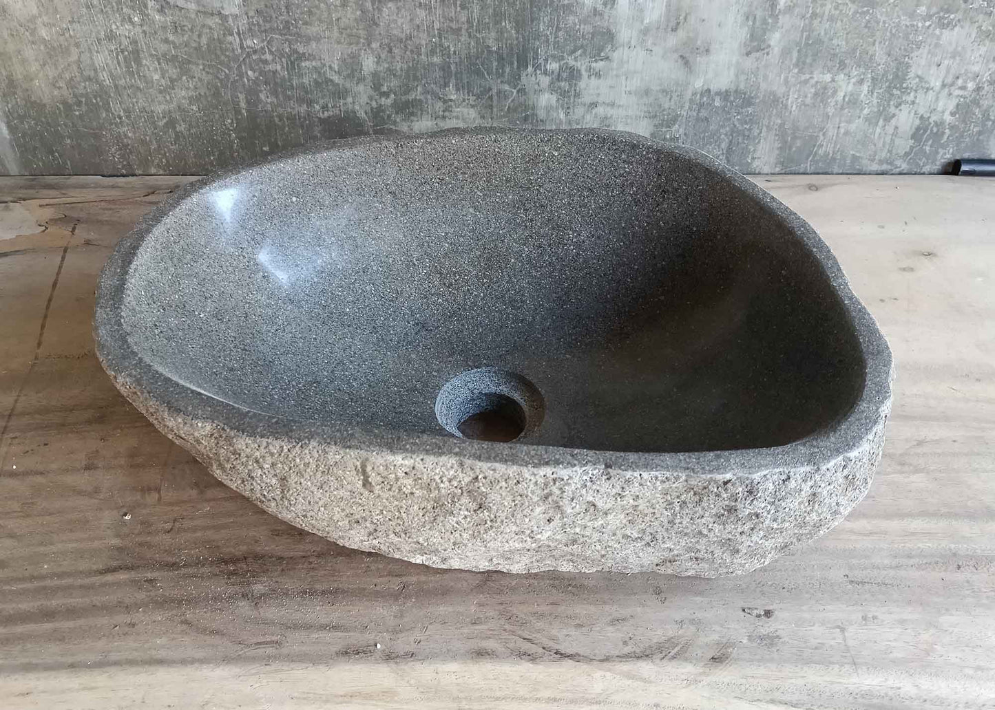 Left side view of 16×13 inch gray river stone sink in oval shape