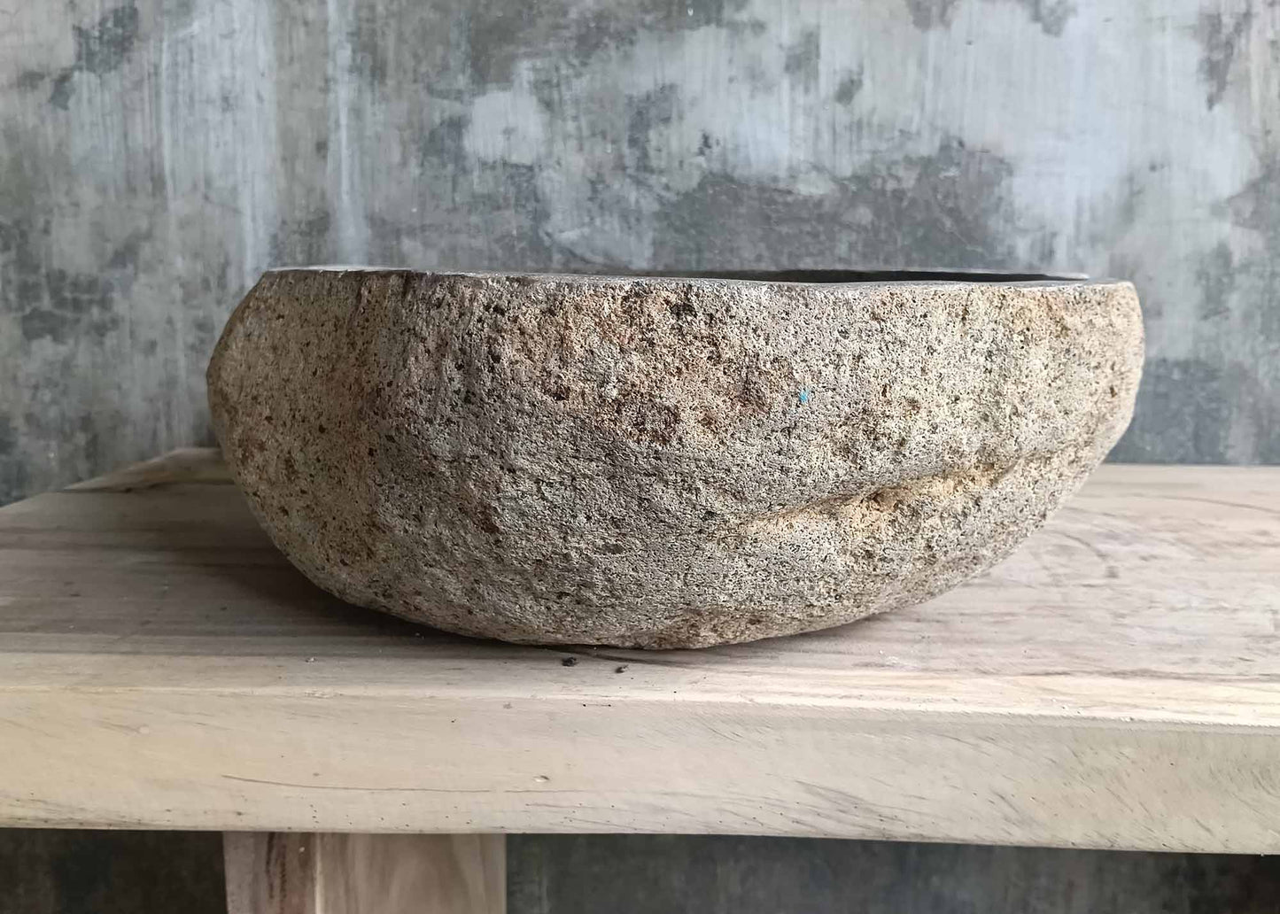 Underside of sink 6347-5845 showing organic river stone base and drain opening