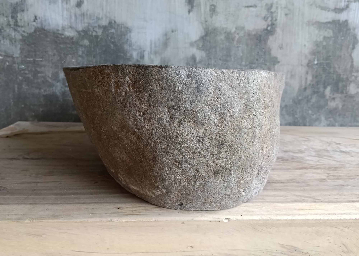 Left side of irregular sink showing flowing contours and organic shape
