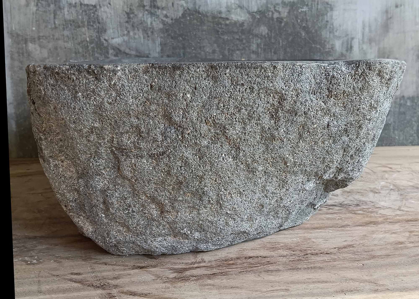 Rear view highlighting the chiseled back of the stone sink