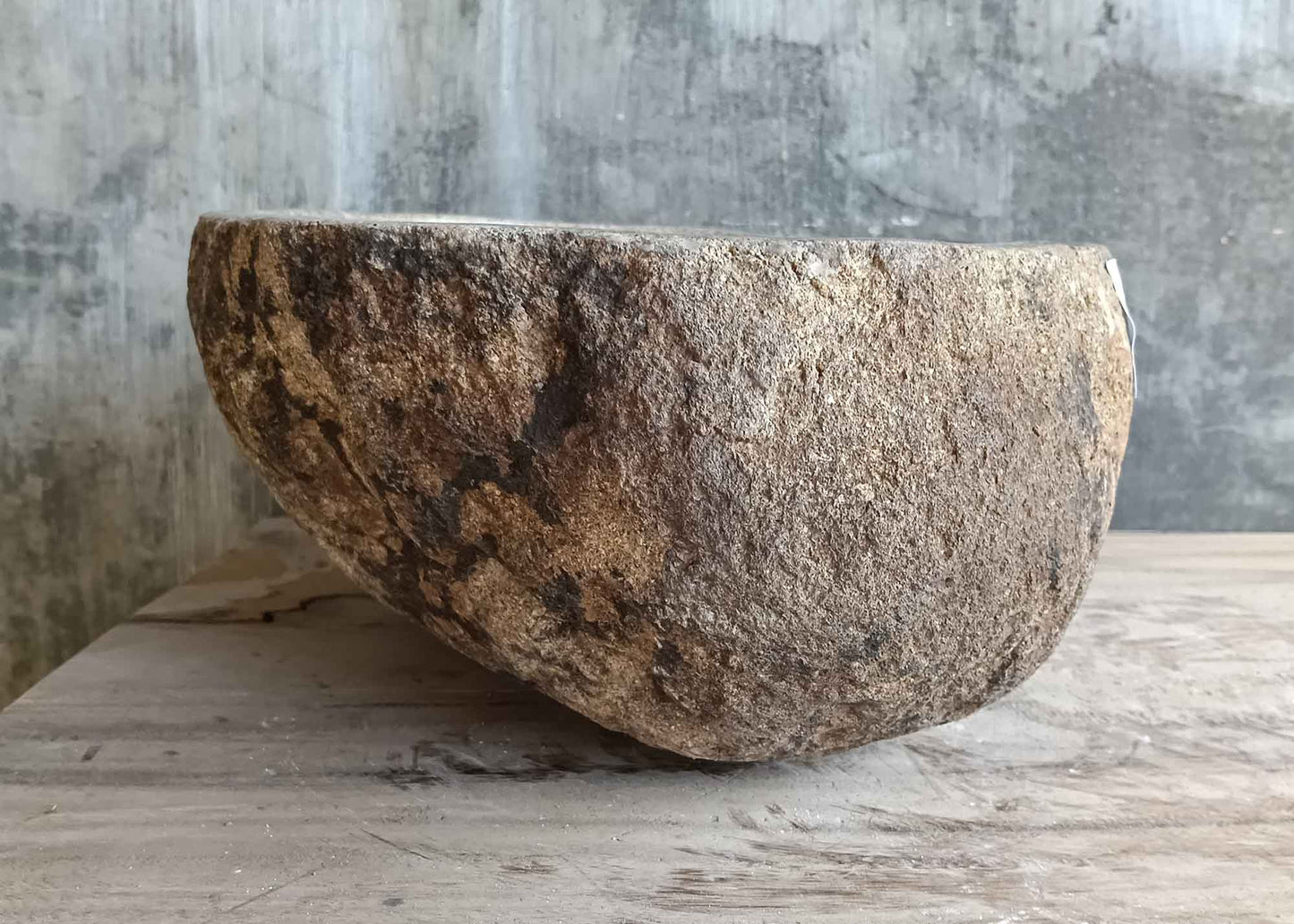 Right side view of 14×12 inch light beige river stone sink showing raw stone finish