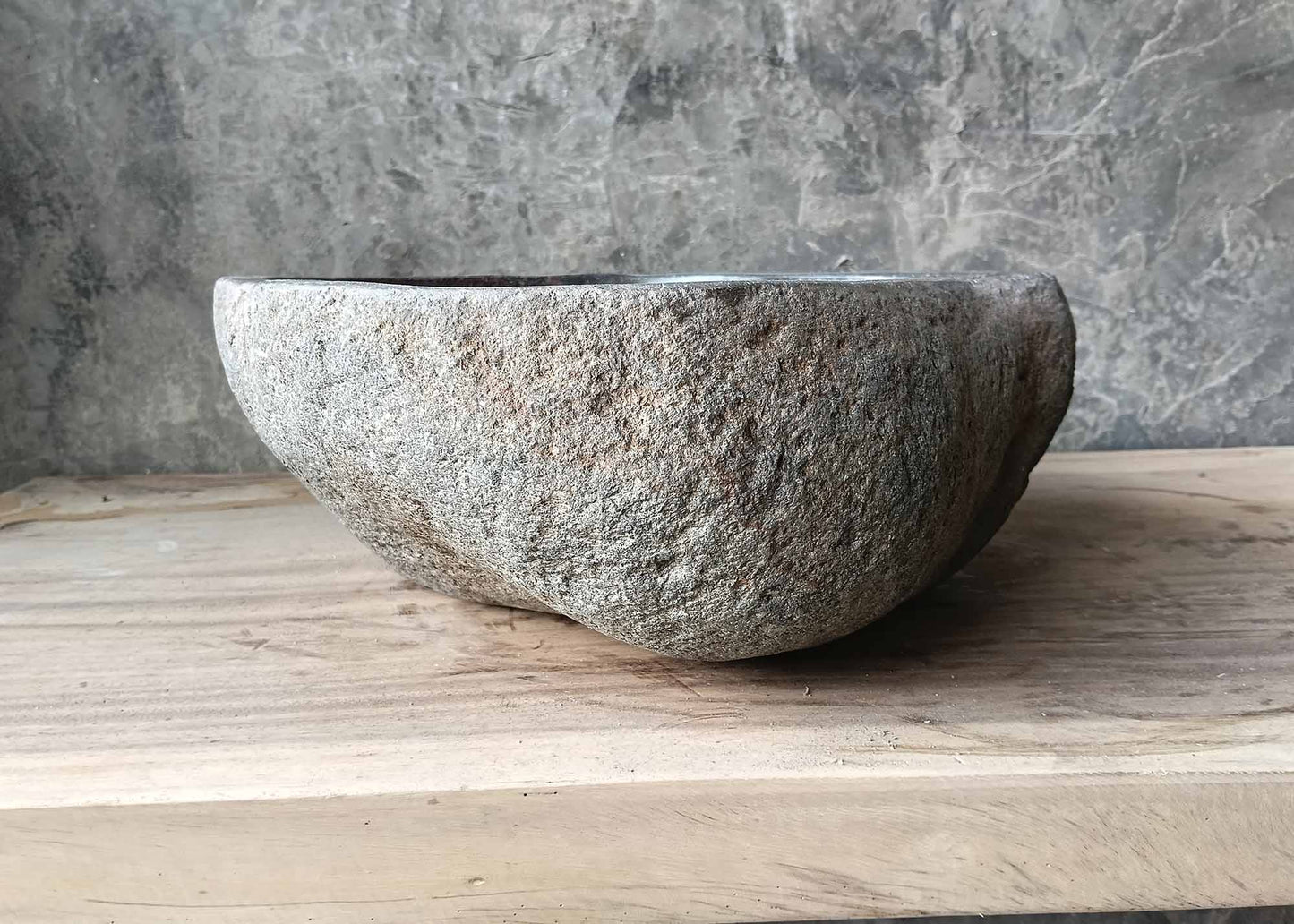 Raw stone exterior with organic form – right view