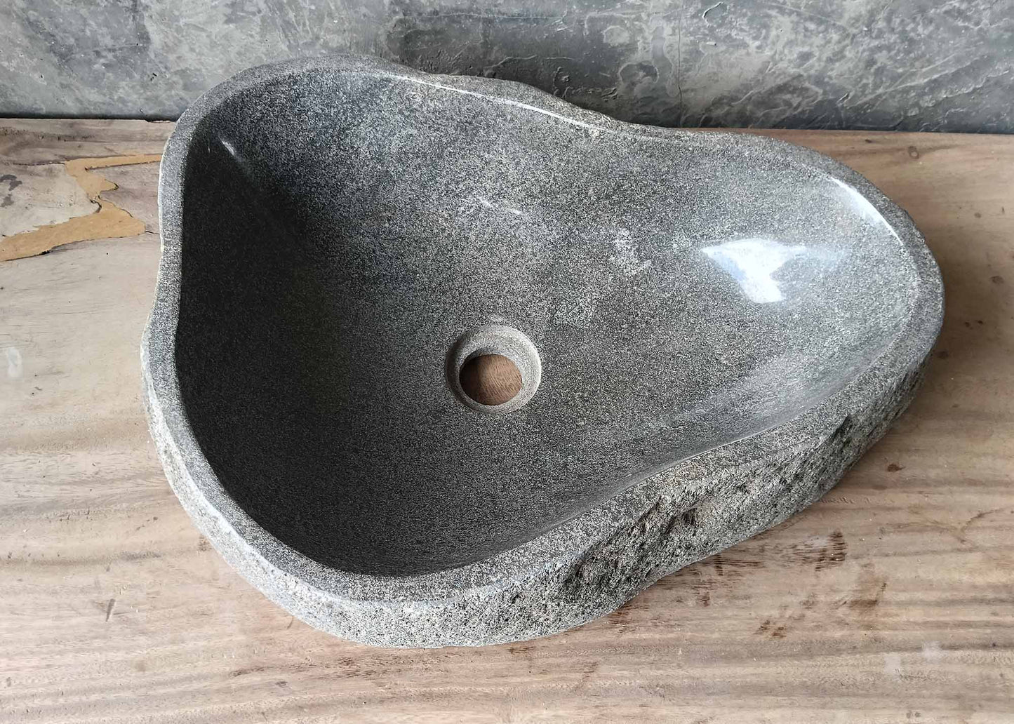 Polished taupe-gray river stone sink – top view