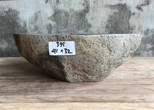 Organic contour stone sink with earthy texture – front view