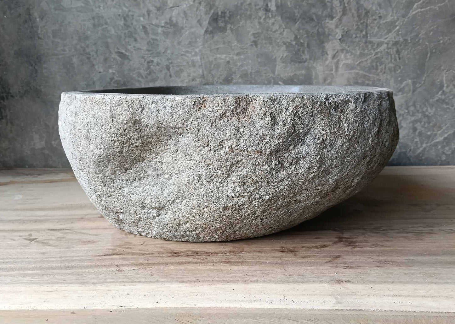 Raw exterior handcrafted stone sink – left side view