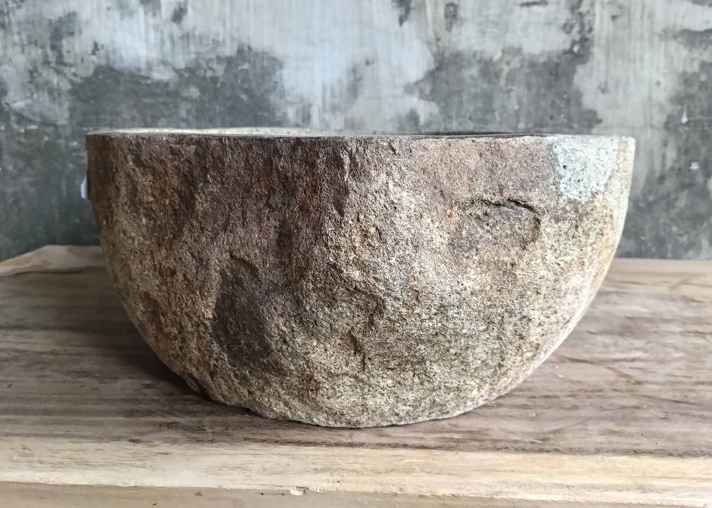 Back side of stone sink with rugged natural rock texture