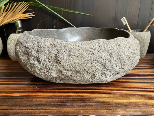 Front angled view of charcoal-gray river stone vessel sink RSS-010