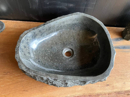 Gray andesite stone bathroom vessel sink ANS-005 showing its rough chiseled exterior and rounded triangular form