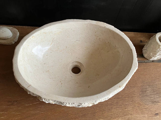 Natural beige marble bathroom vessel sink BMS-004 showing its rough chiseled exterior